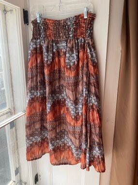 Le Grenier | Boho Smocked Waist Midi Skirt in Rust Chevron Print
